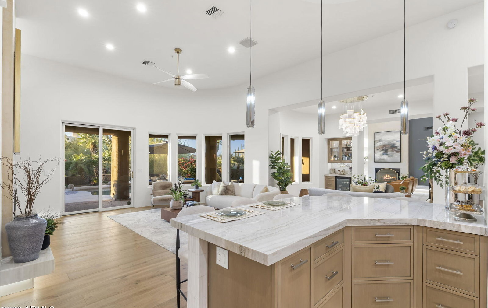 Quartzite waterfall island with brass pendants